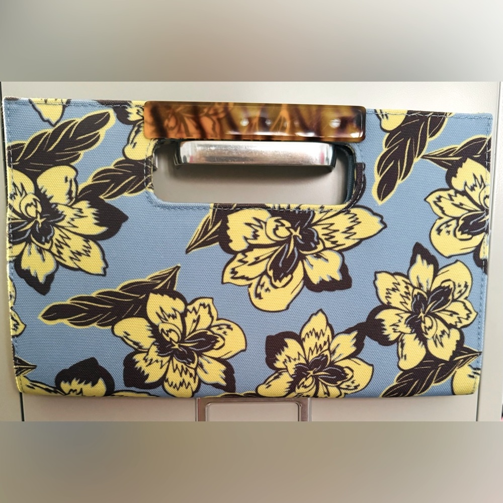 New with tags. Charming Charlie Blue Floral Clutch.